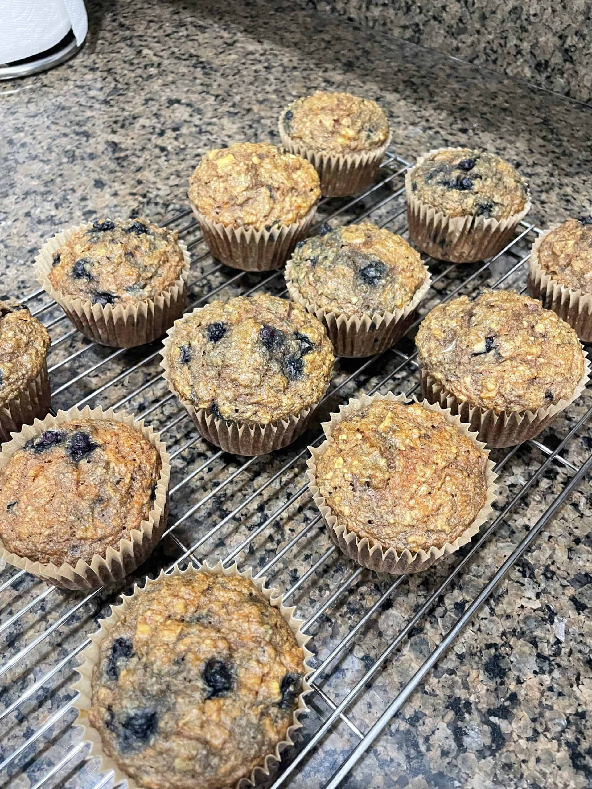 blueberry muffins on a metal cooling tray
